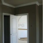 painting of wood trim, baseboards and crown moulding