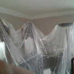Furniture Covered With plastic wrap protection by painters before painting