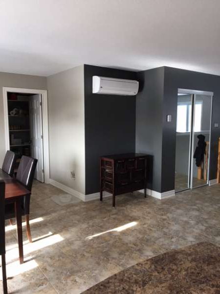 dining room painted in revere pewter with entrance in kendall charcoal paint by house painters in Ottawa PG Paint & Design