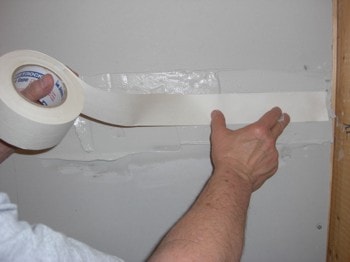 drywall tape applied over mudding to repair walls before painting