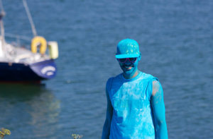 a man wearing clothes covered in paint